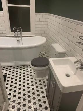 Traditional bathroom plumbing and tiling installation