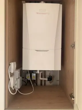 Domestic boiler installation in cupboard